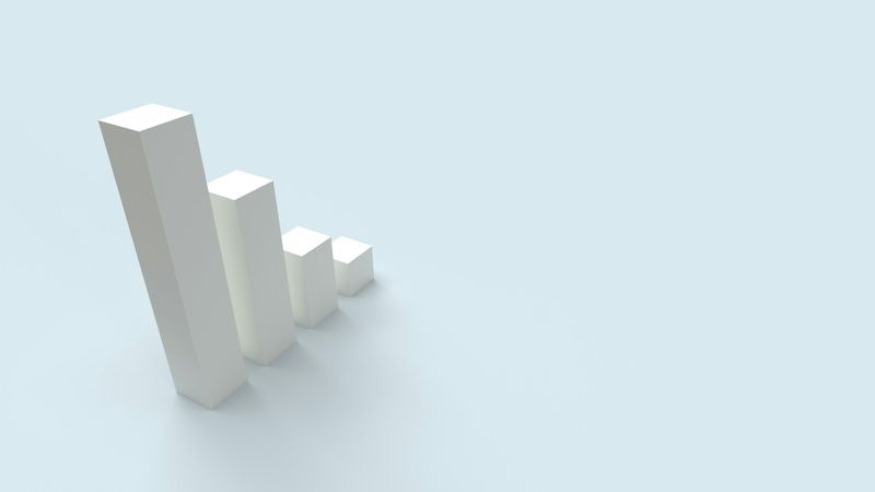 The image features a series of ascending white bars representing growth or increasing metrics, set against a light blue background. The visual suggests themes of progress and advancement.