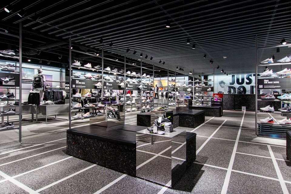 a room filled with lots of black and white shoes