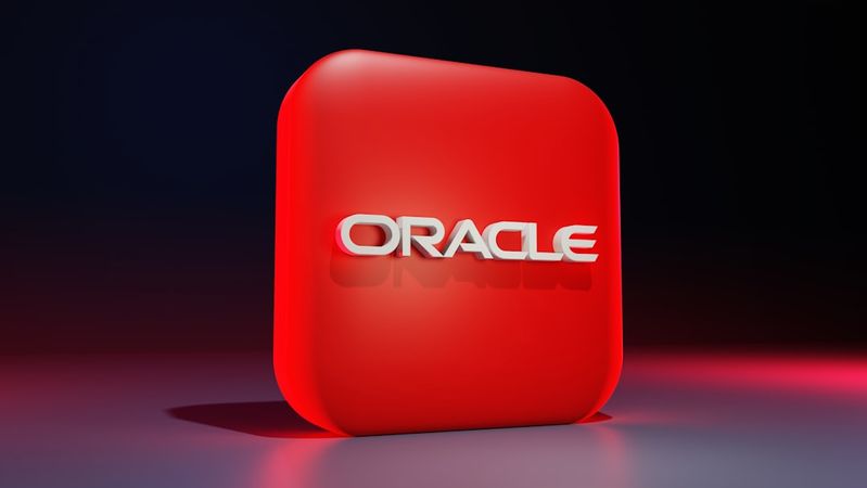The image features a prominently displayed three-dimensional logo of Oracle, set against a gradient background. The logo is rendered in white text on a vibrant red square platform.