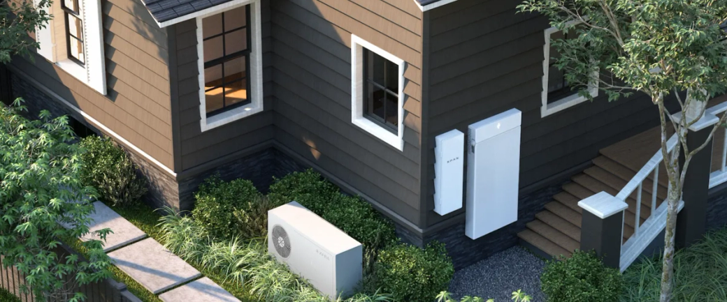 The image features a modern home with a sleek design, showcasing energy-efficient appliances and a landscape garden. Visible installation includes a home battery system positioned outside the house.