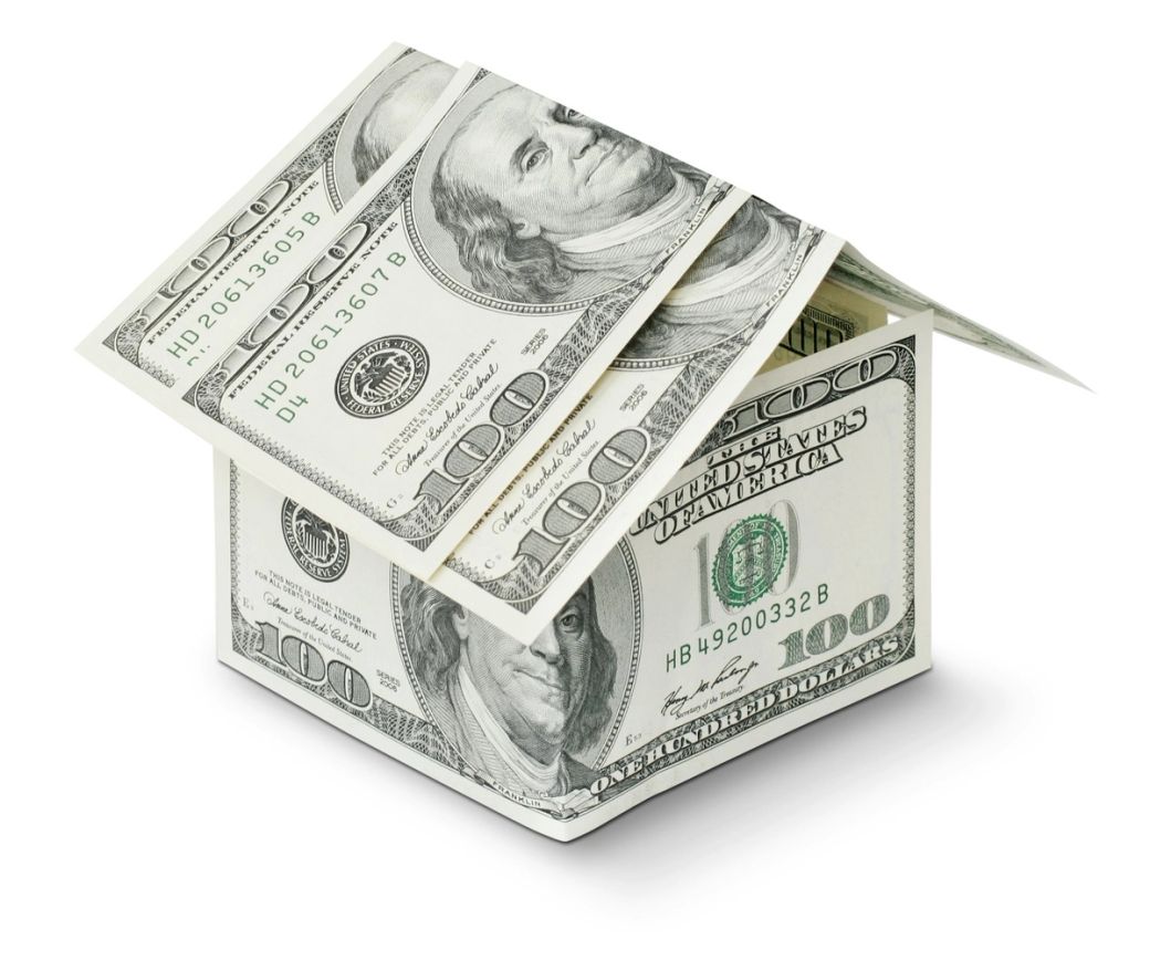 The image depicts a box made of U.S. one hundred dollar bills, symbolizing wealth or financial investment. The open box suggests the concept of opportunity or financial planning. — Credit: Photo by Kostiantyn Li / Unsplash