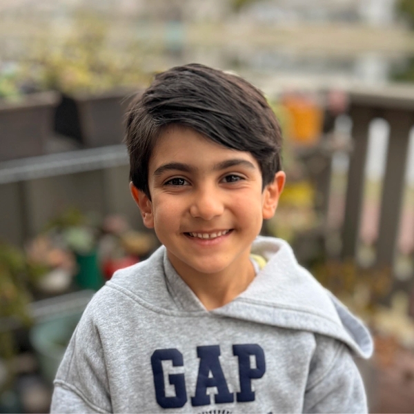 Portrait taken with iPhone 16 Pro showing computational bokeh with inconsistent focus plane — left eye sharp, right eye soft