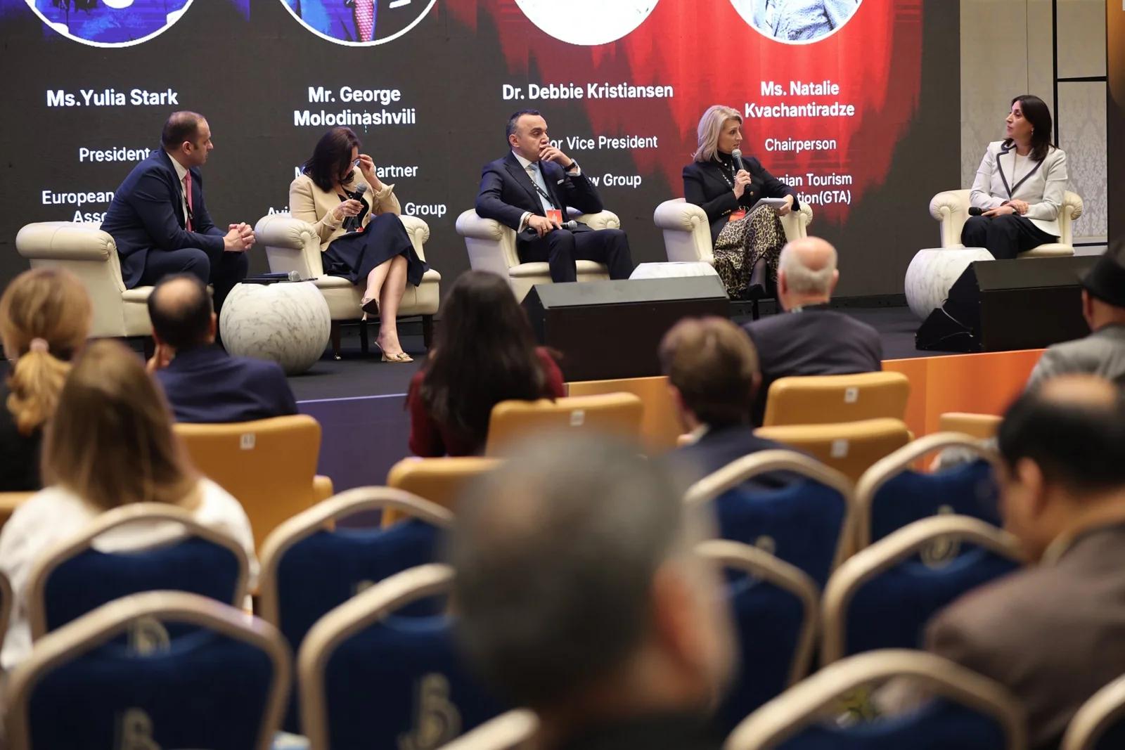 Panellists speaking with the conference audience at GIF Georgia 2025.