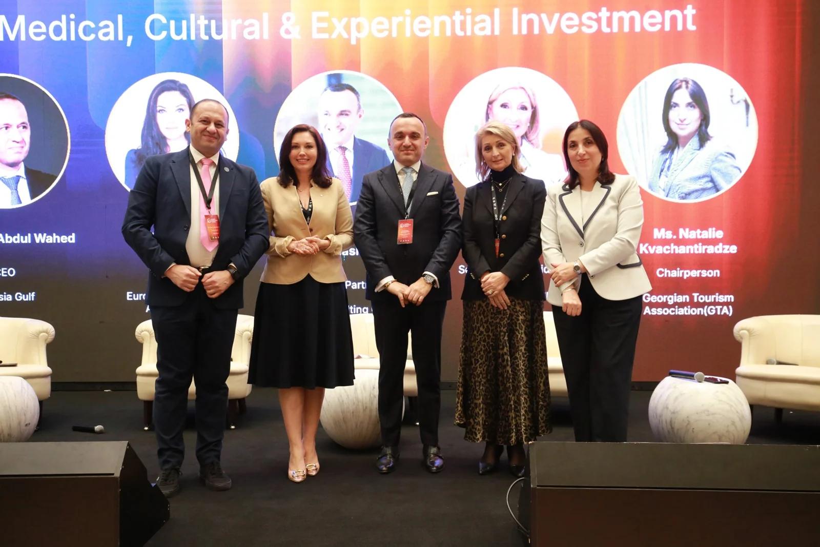 A group on stage after a panel discussion at GIF Georgia 2025.