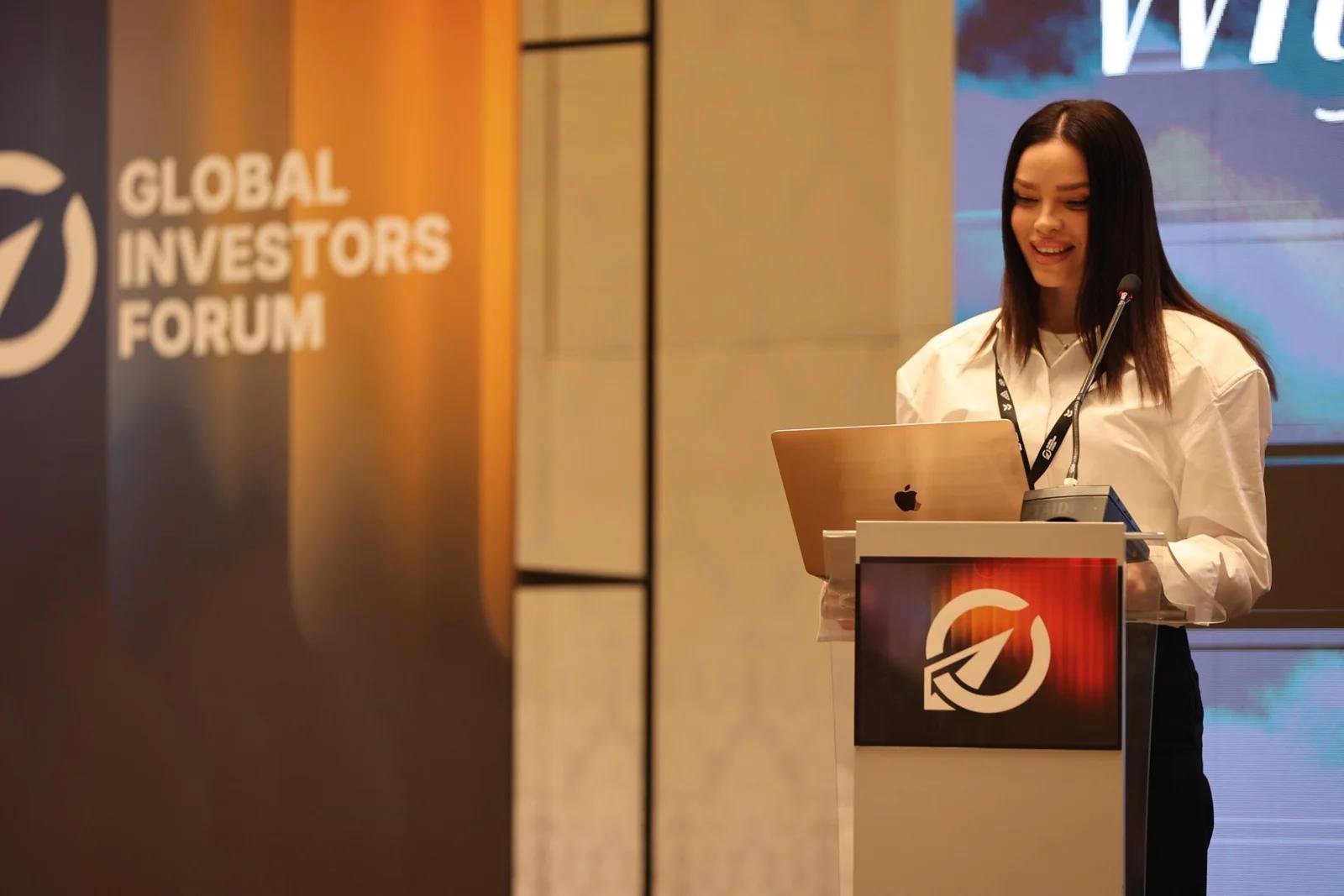 A presenter at the lectern at GIF Georgia 2025.