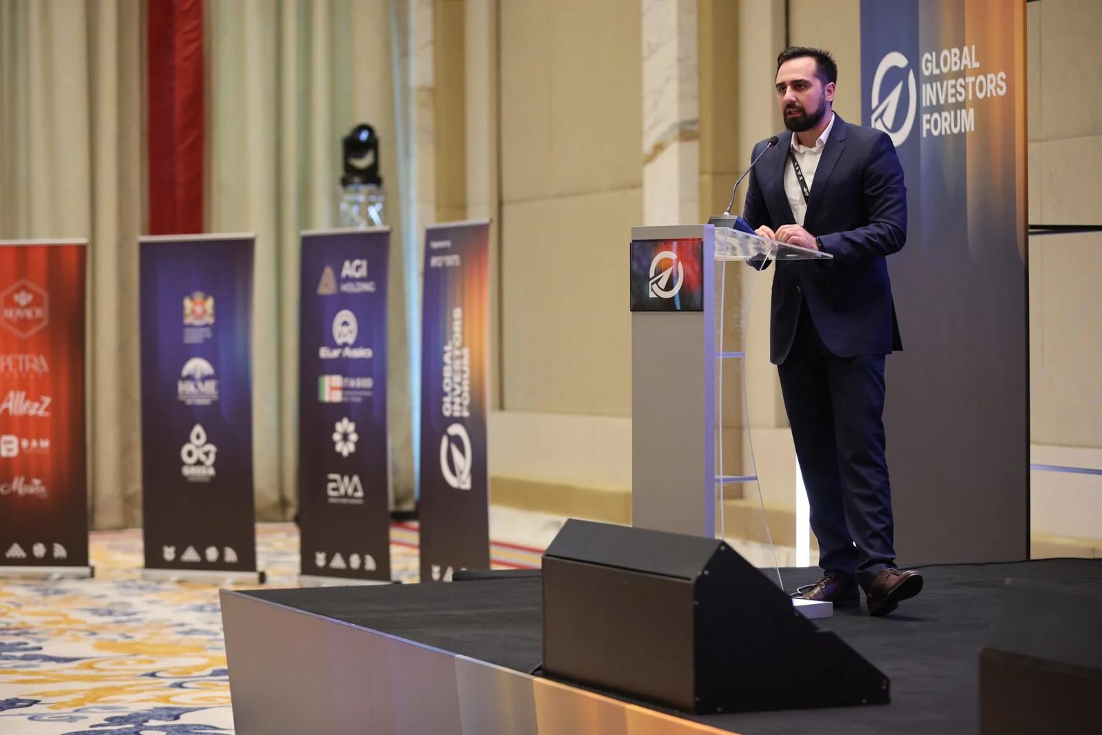 A speaker delivering a presentation at GIF Georgia 2025.