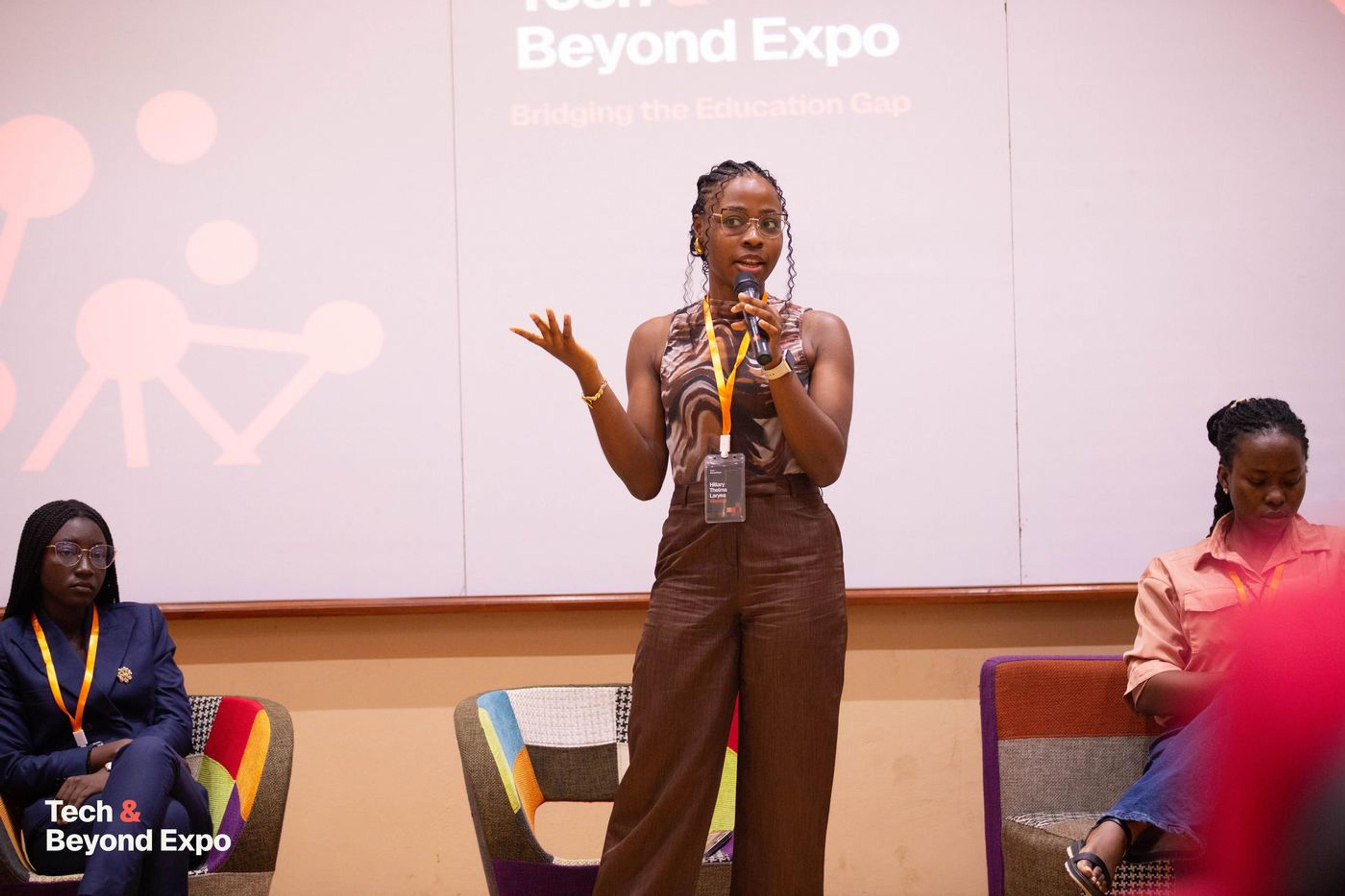 A speaker addressing the audience from the stage