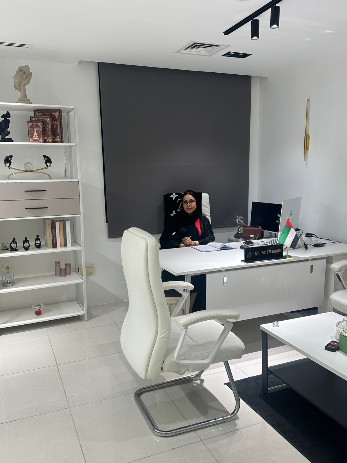 Dr. Faten seated at her office desk