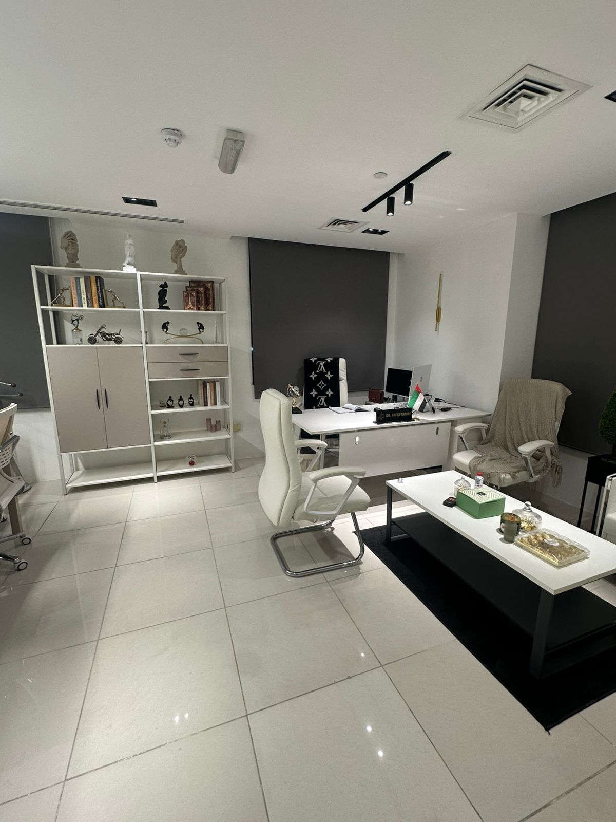 The desk, bookshelves and seating area in our Abu Dhabi office