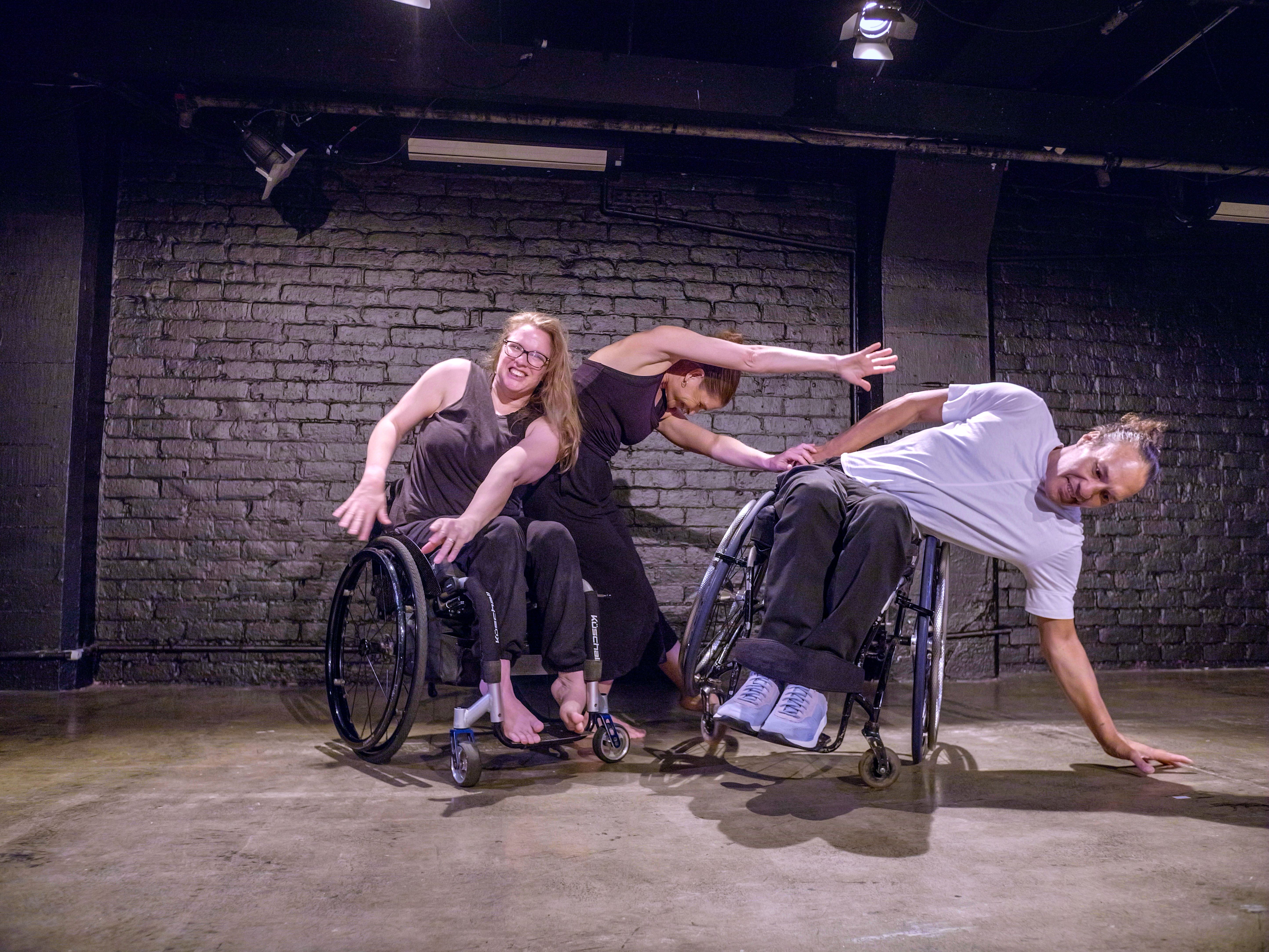 Touch Compass dancers Alisha, Julie and Rodney lean differently
