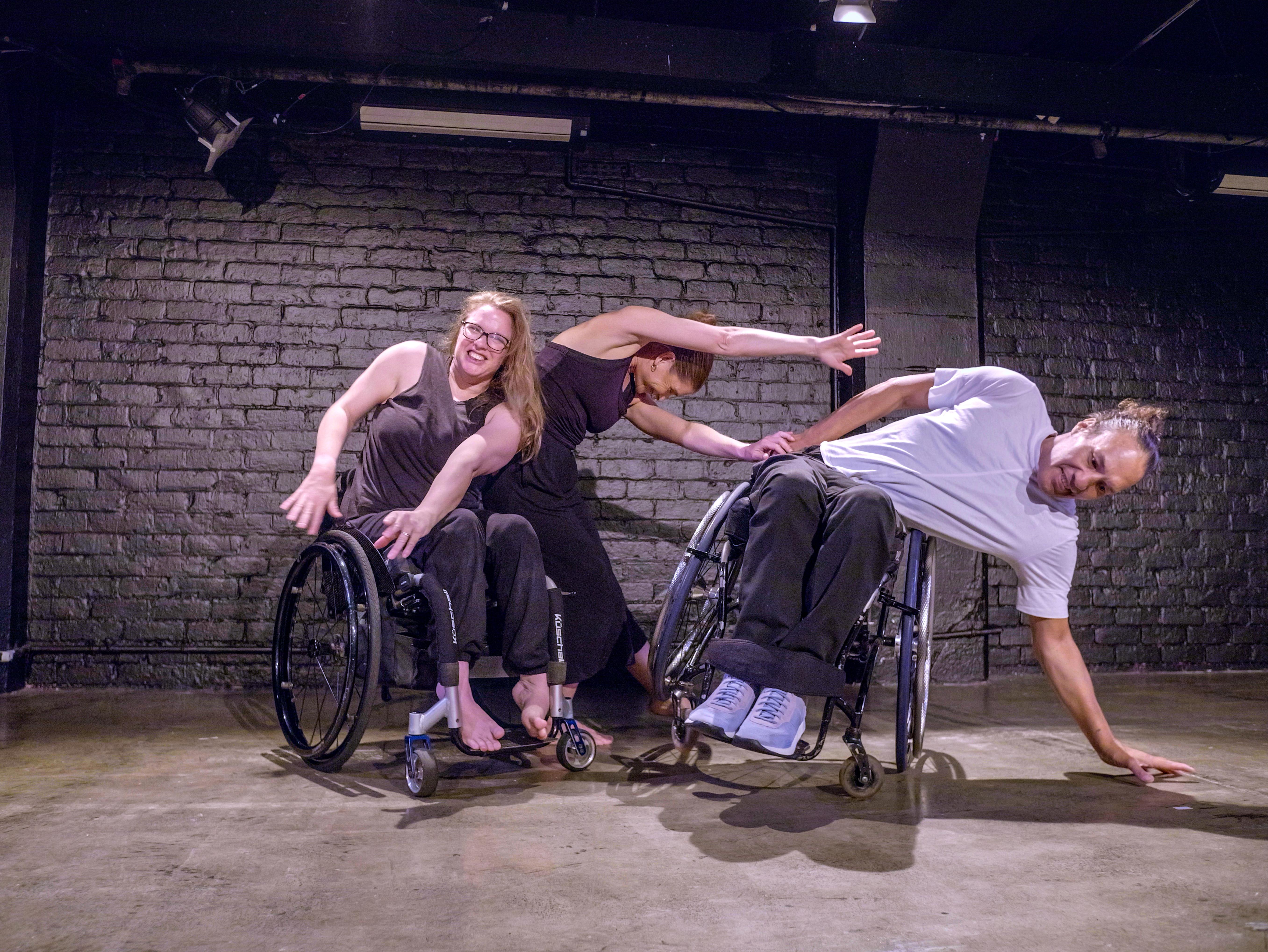 Touch Compass dancers Alisha, Julie and Rodney lean differently