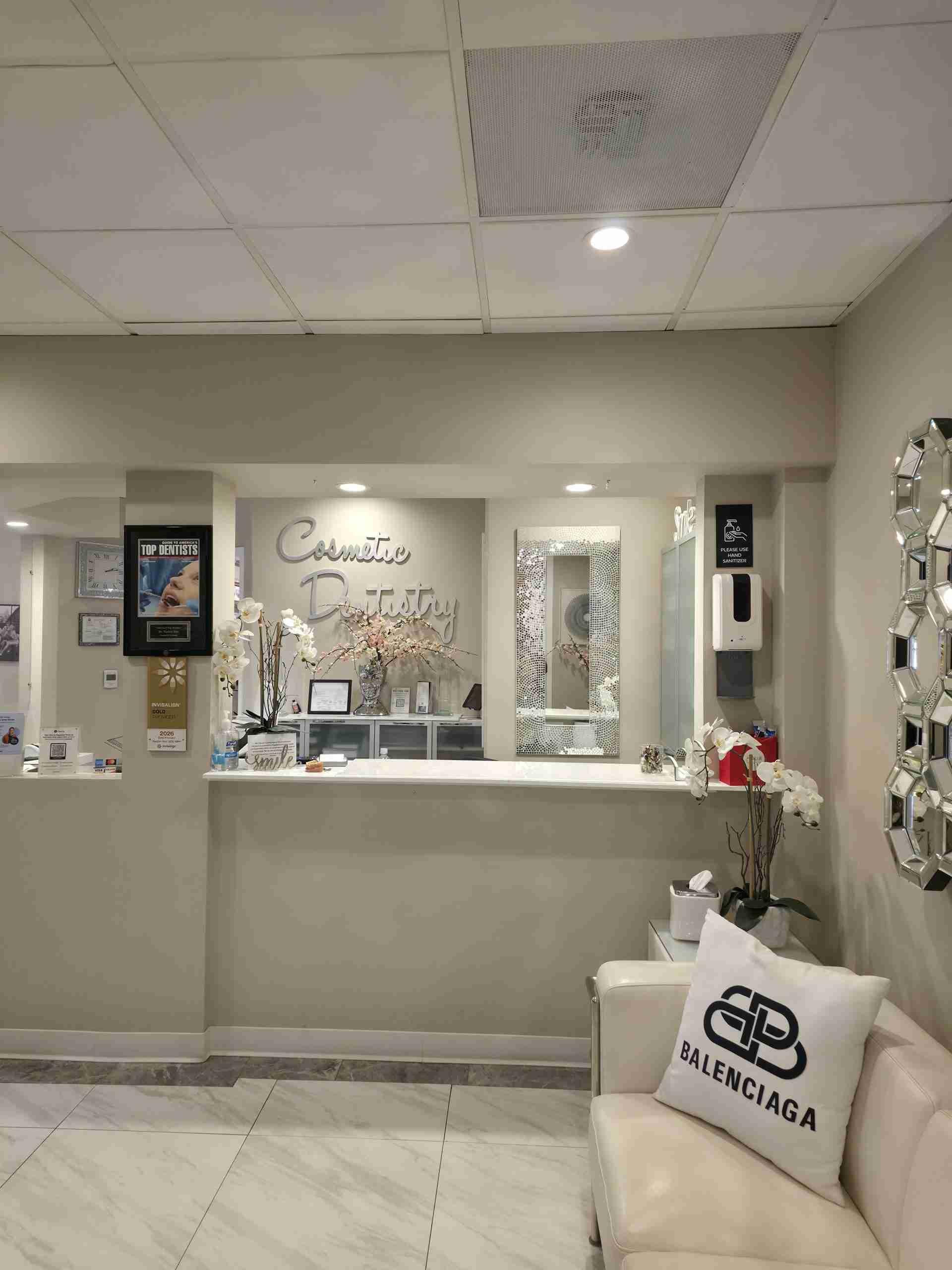Reception desk and waiting area with the Cosmetic Dentistry sign