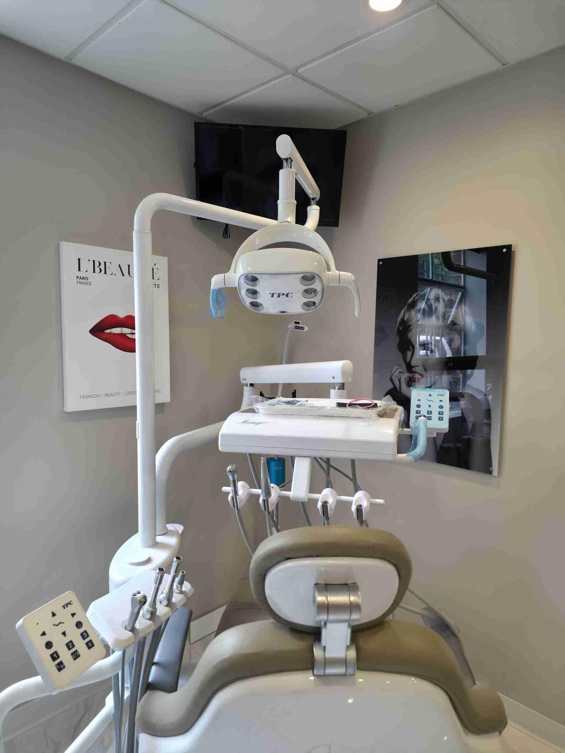 Treatment room with a dental chair and digital X-ray monitor