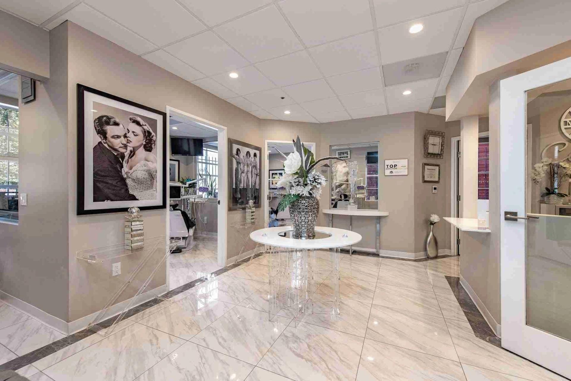 Wide view of the office hallway with framed photographs