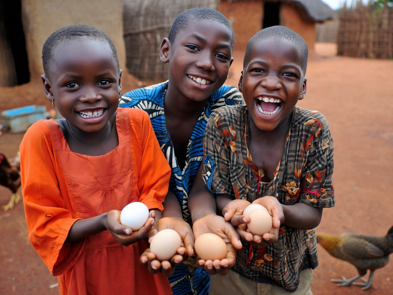 Young kids posing with their eggs with incredible smiles