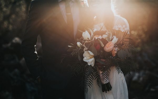 Bride and groom at a luxury Dubai wedding venue with warm golden light