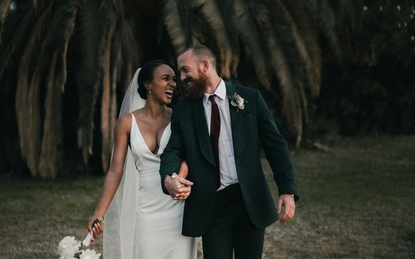 A couple walking hand in hand during their elopement