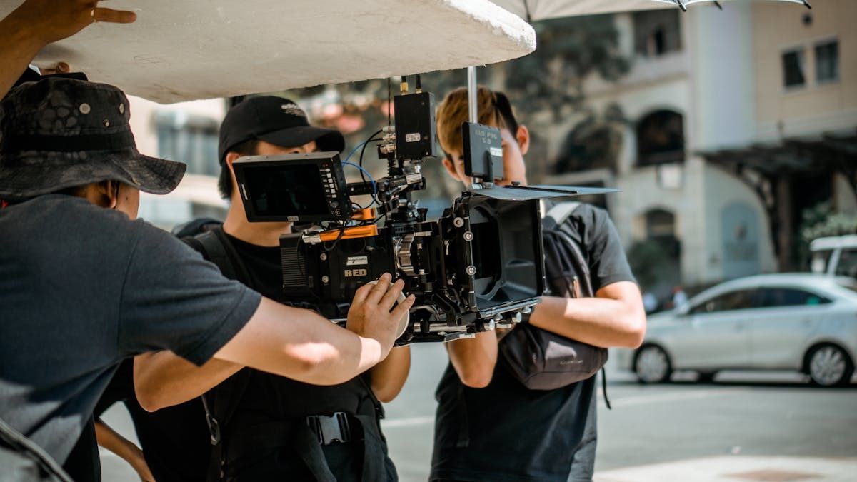 Videographer filming a couple during their wedding day