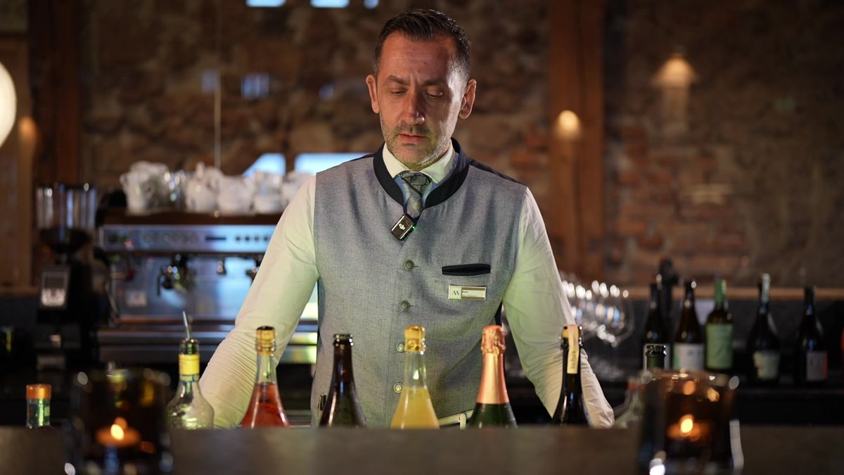 Ioan Olimpiu Lazar, chef de rang at Mount Med Resort, behind the bar