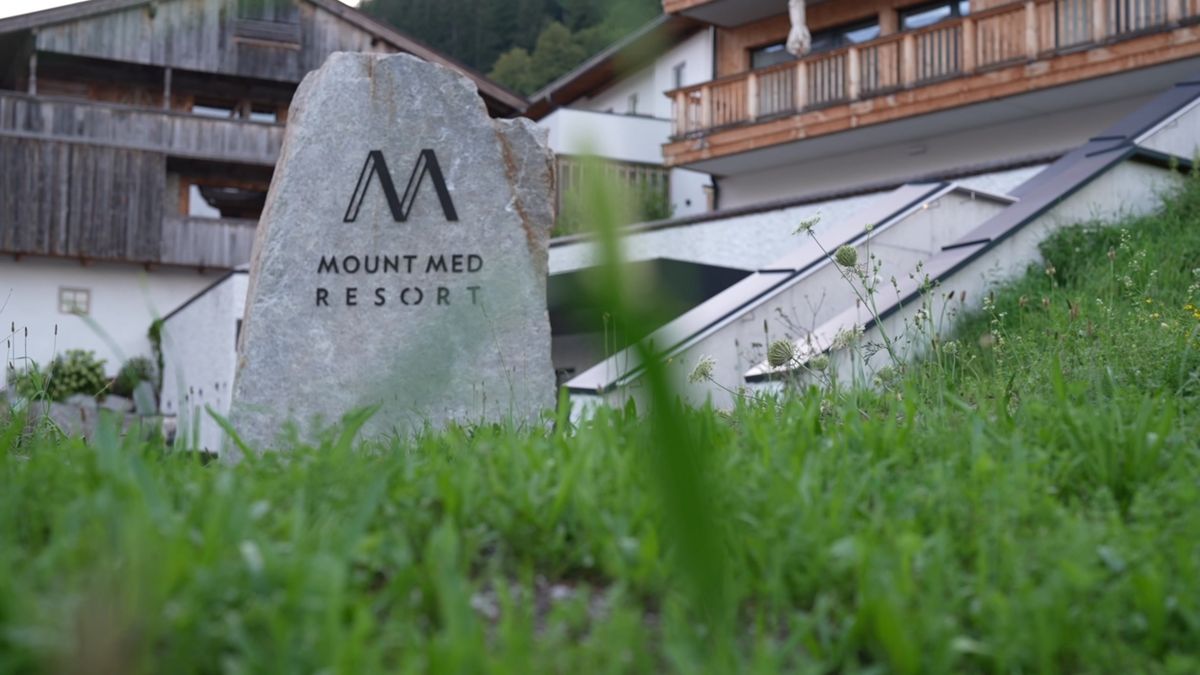 The Mount Med Resort stone sign in front of the resort in Oberau, Tyrol