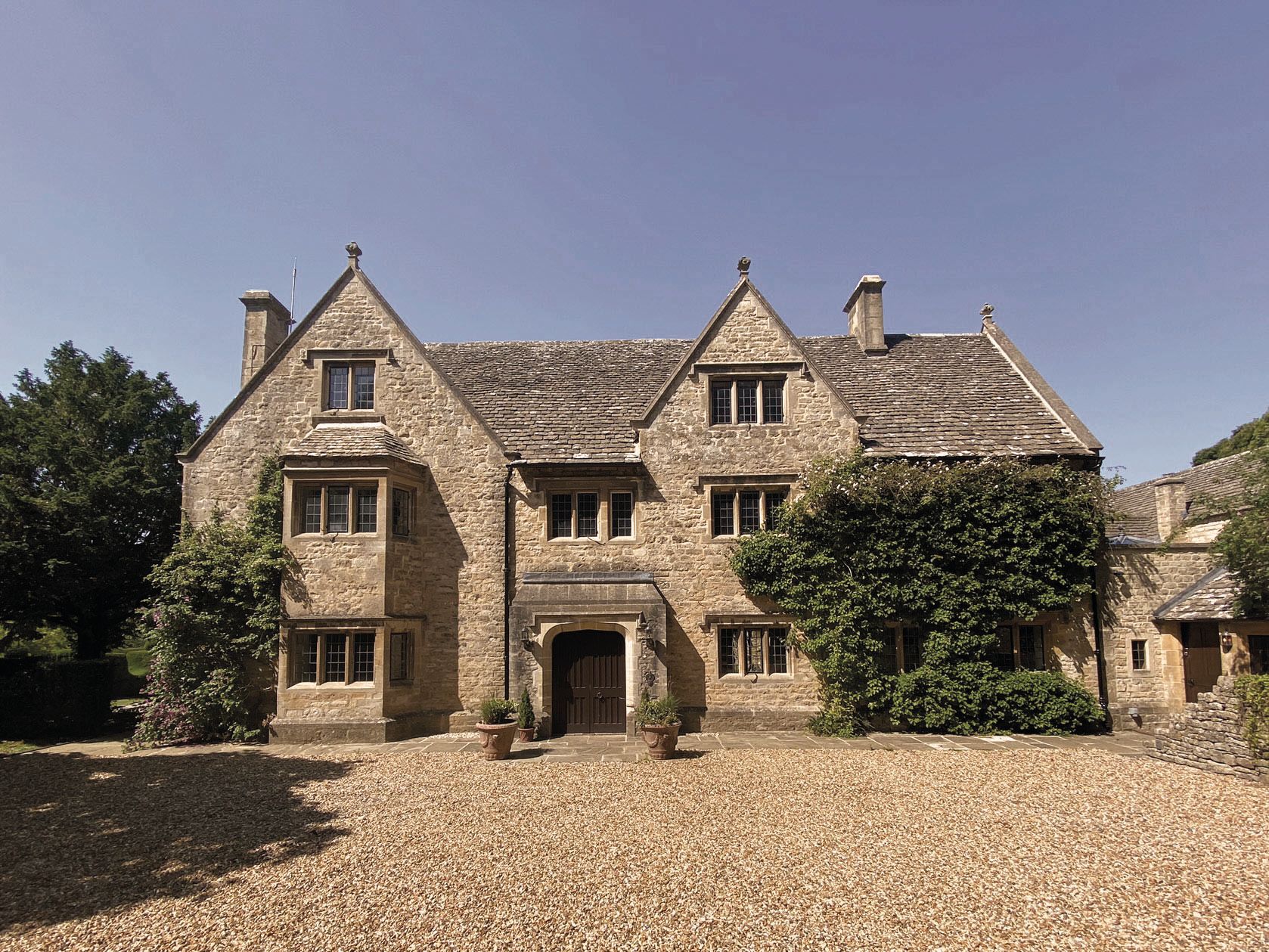 Front elevation and forecourt of Cotswolds manor house