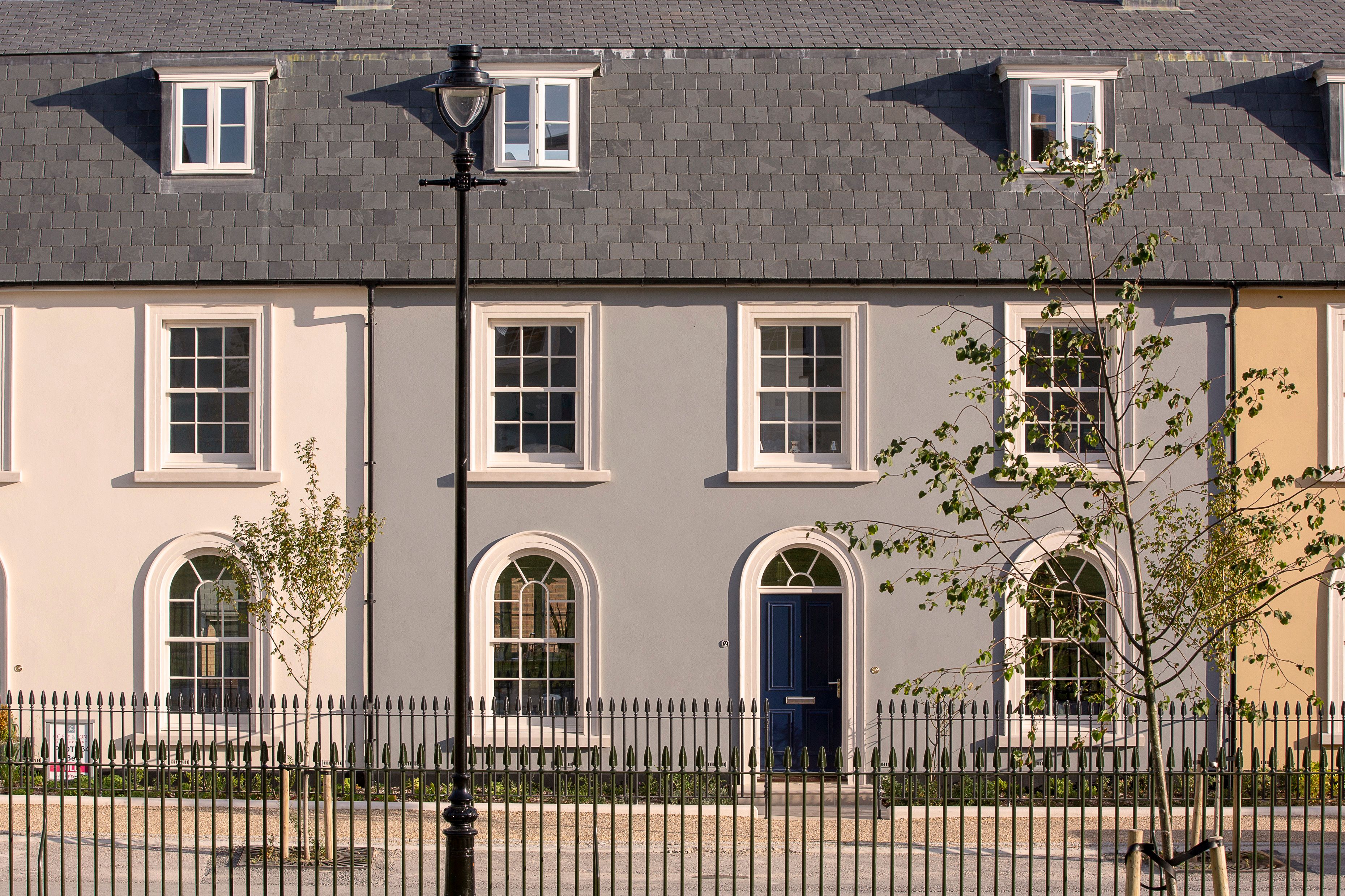 Row of Georgian style painted terrace houses surrounding Hayward Square