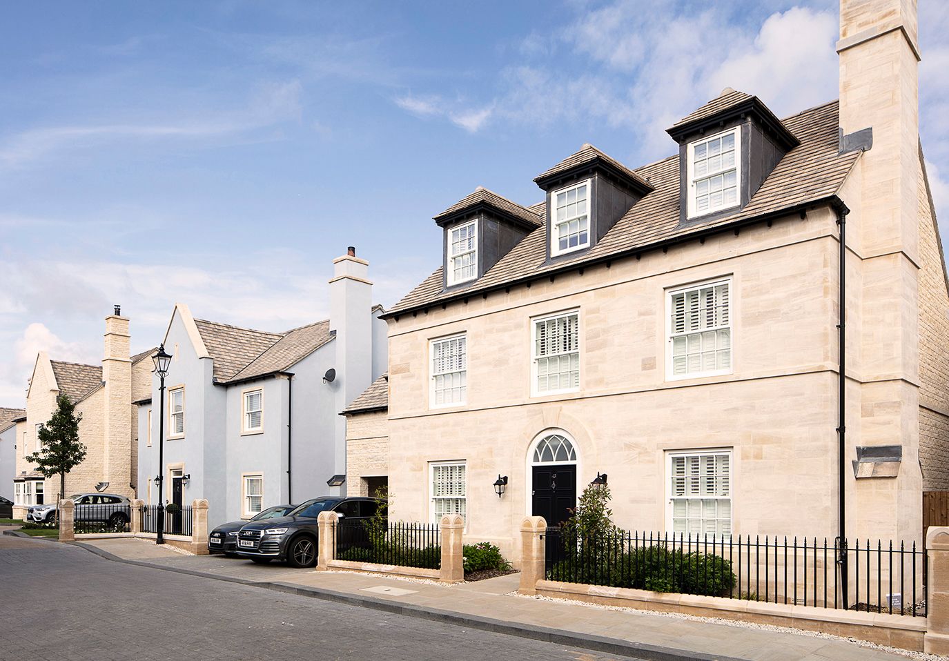 Natural stone and rendered detached new homes 