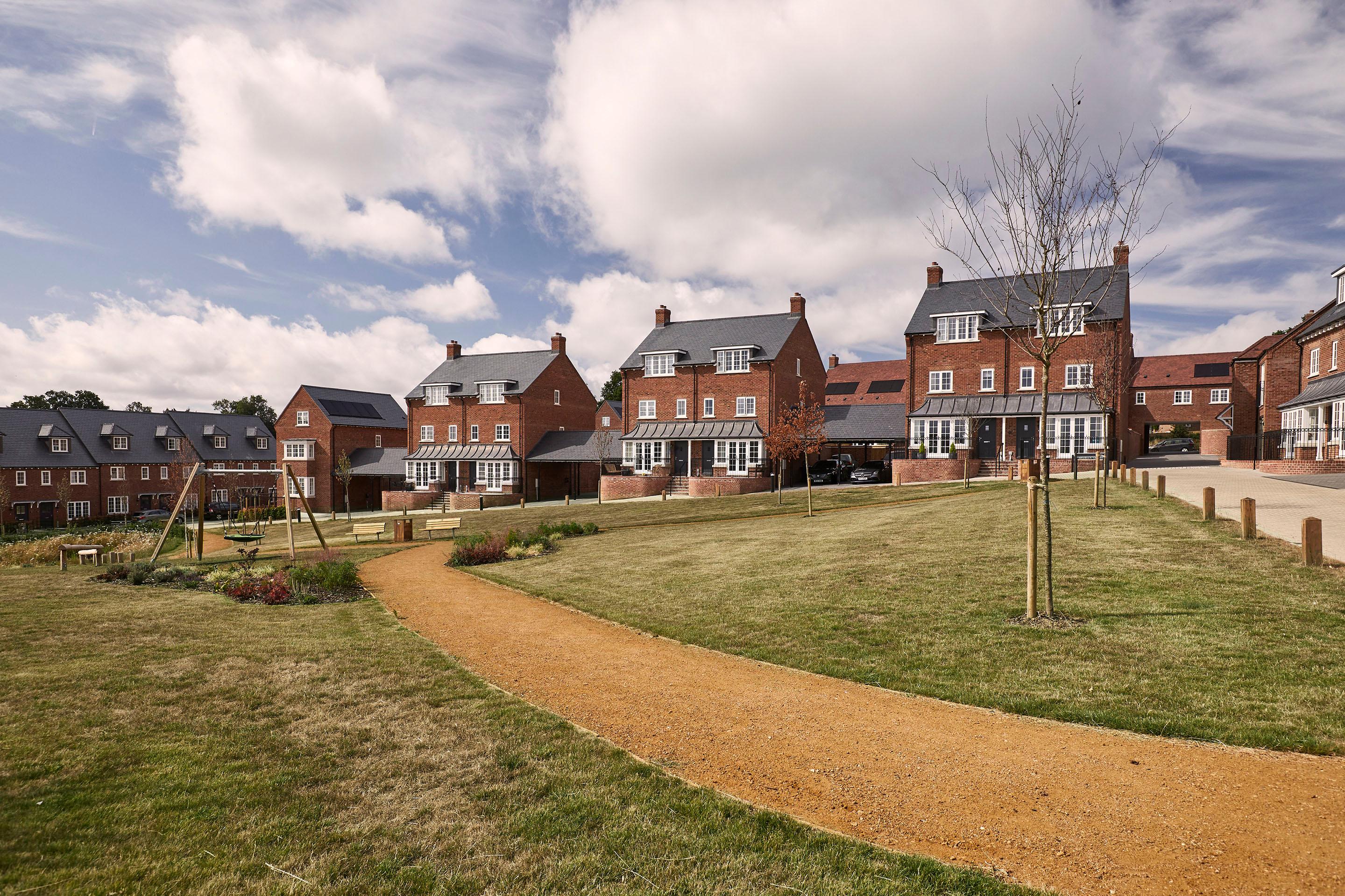 Communal green space surrounded by new homes within Burghfield Common