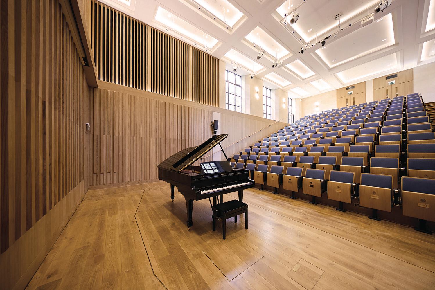 Music hall with profiled oak stage & raked seating auditorium