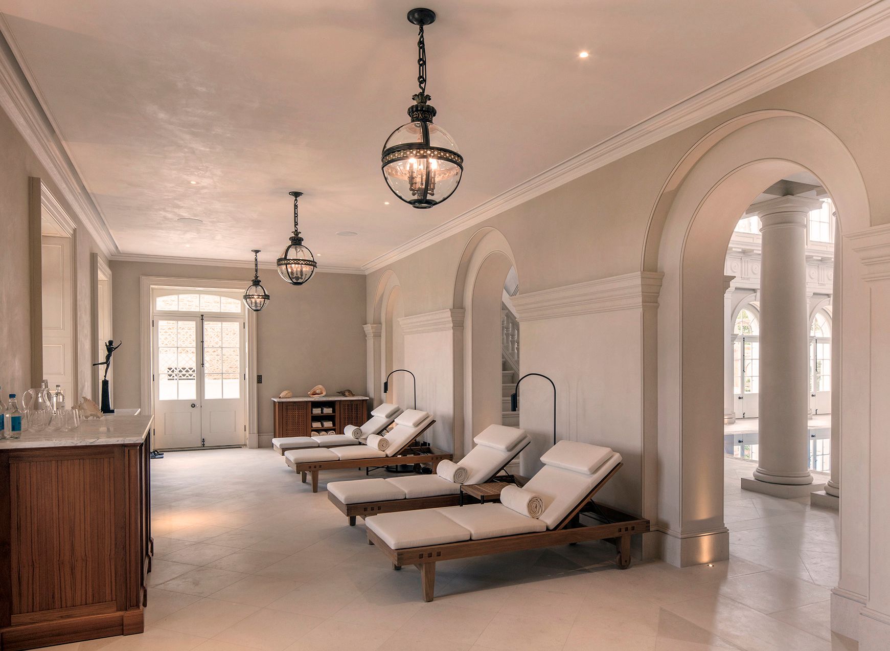 Pool hall interior, relaxing area to the side with day beds