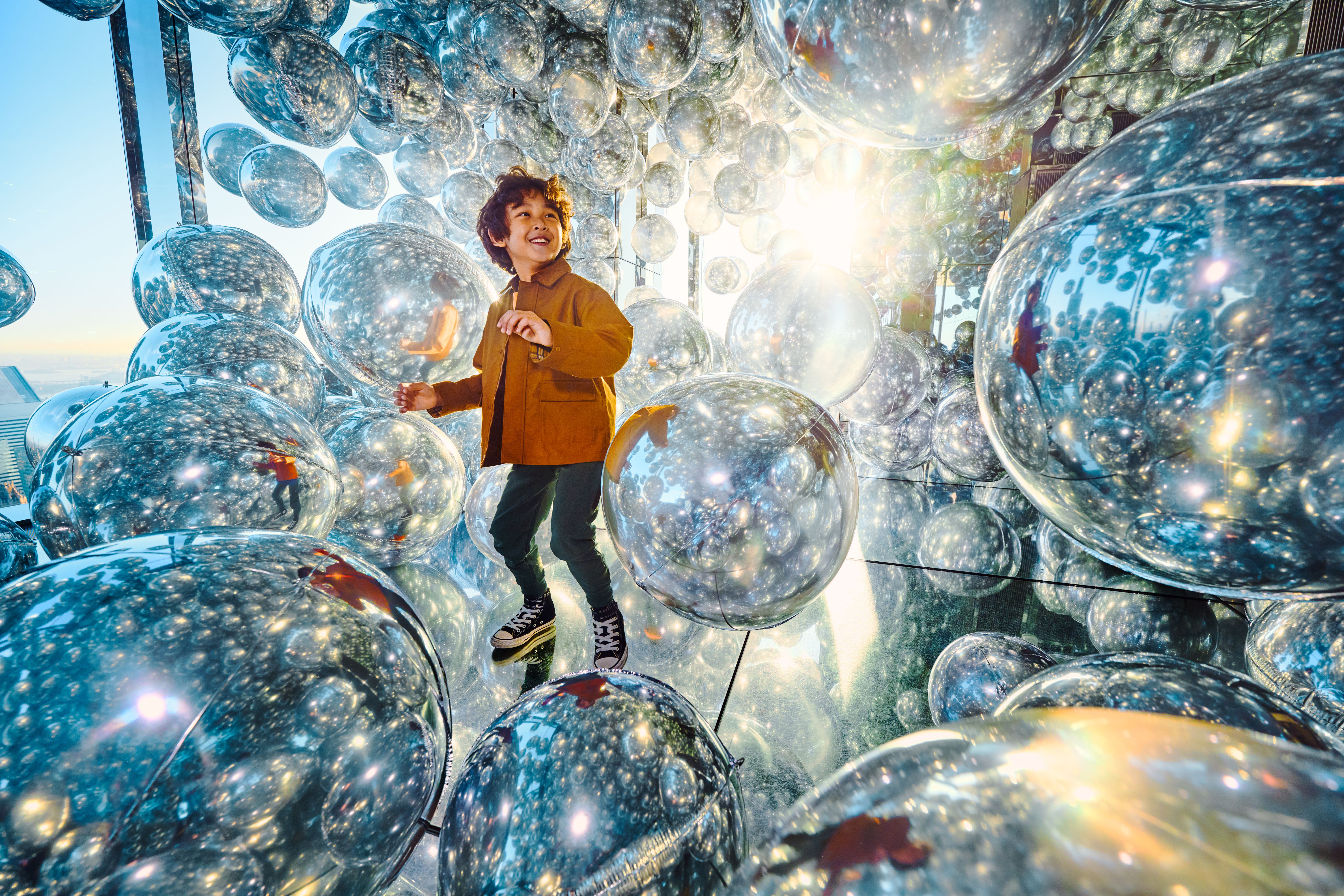 Child in room with balls 