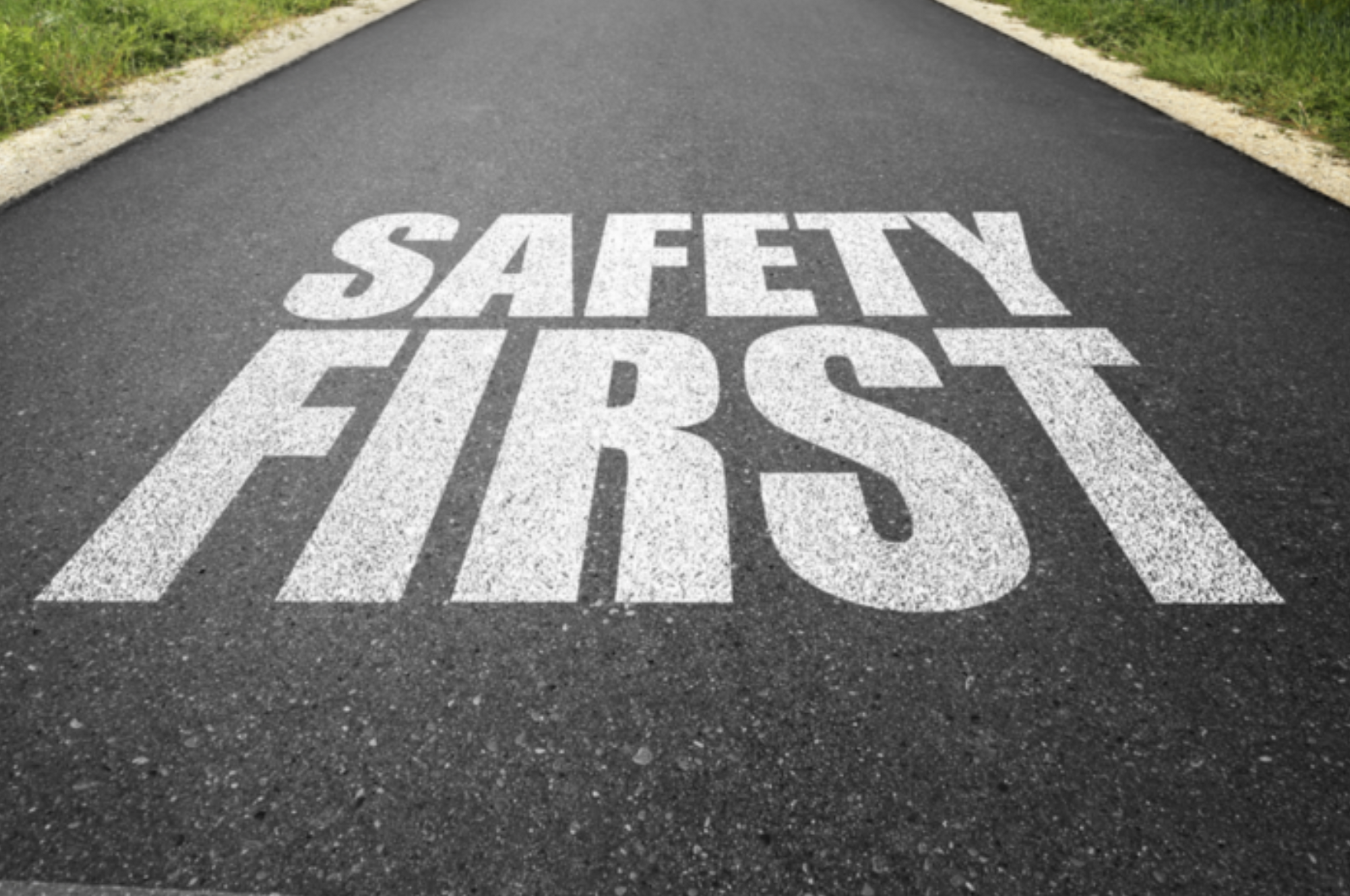 Street with "Safety First" painted on pavement