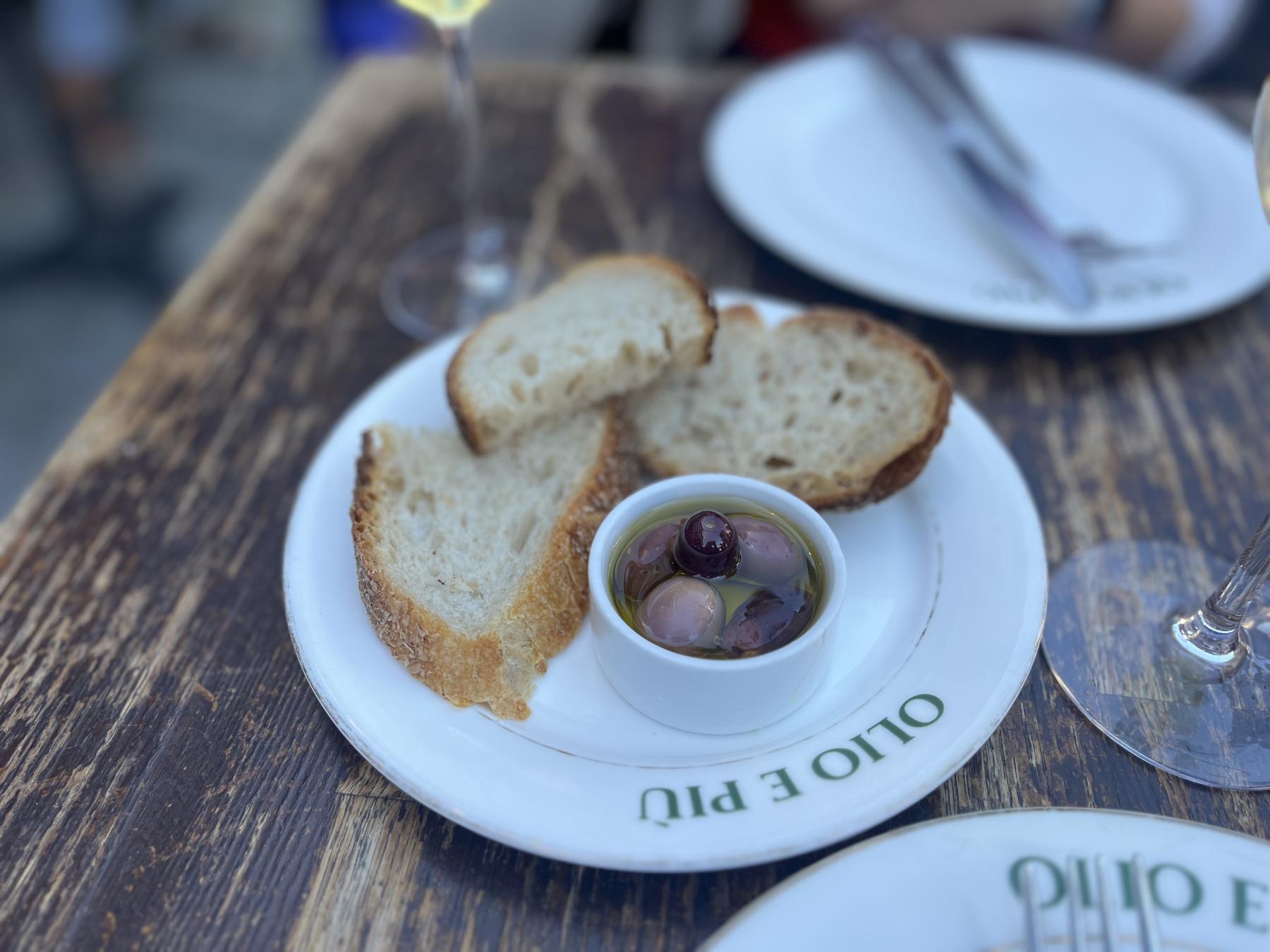 Bread and Olive Oil with whole olive