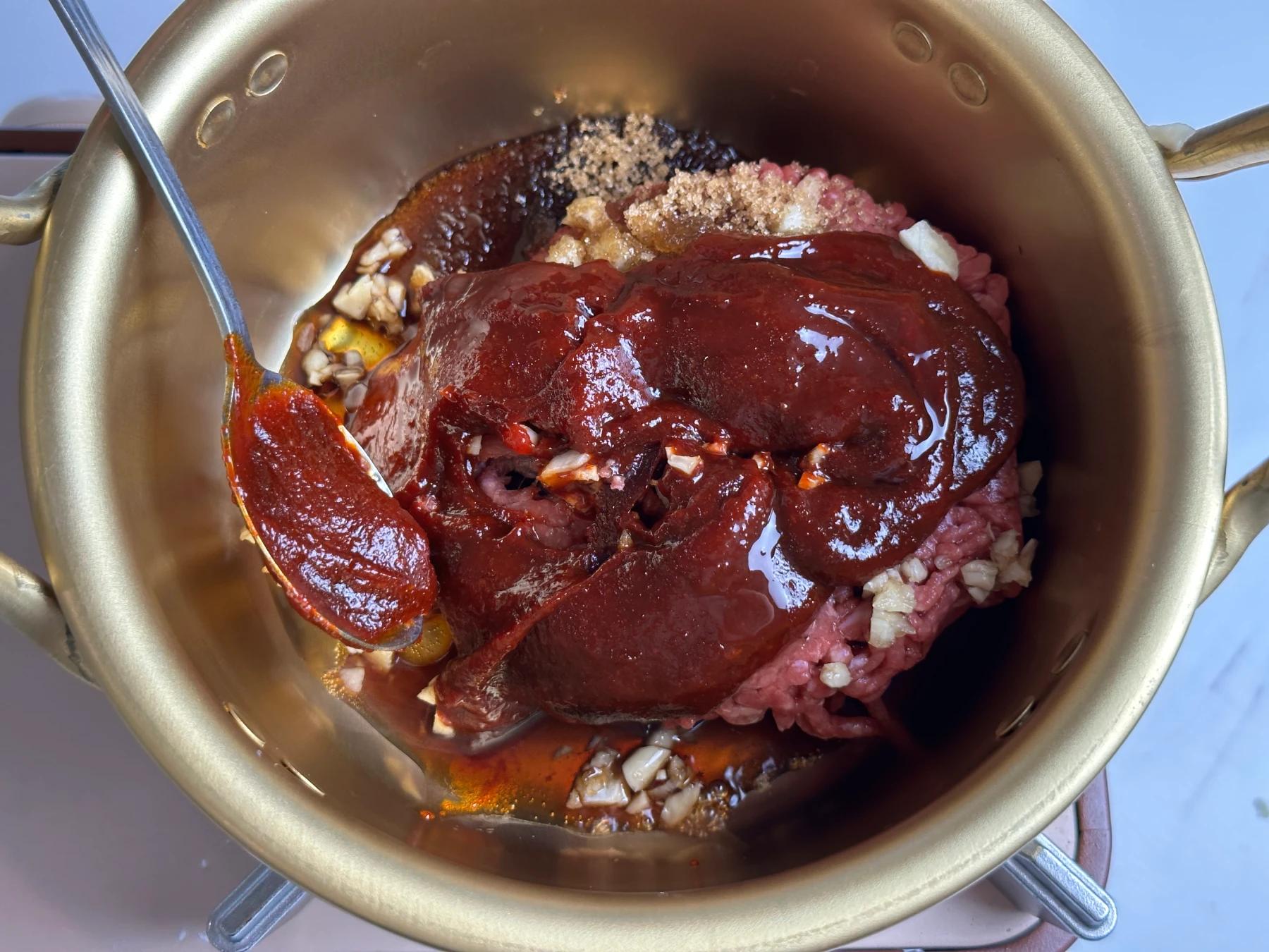 sauce ingredients added to the pot
