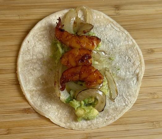 cooked shrimp on the tortilla