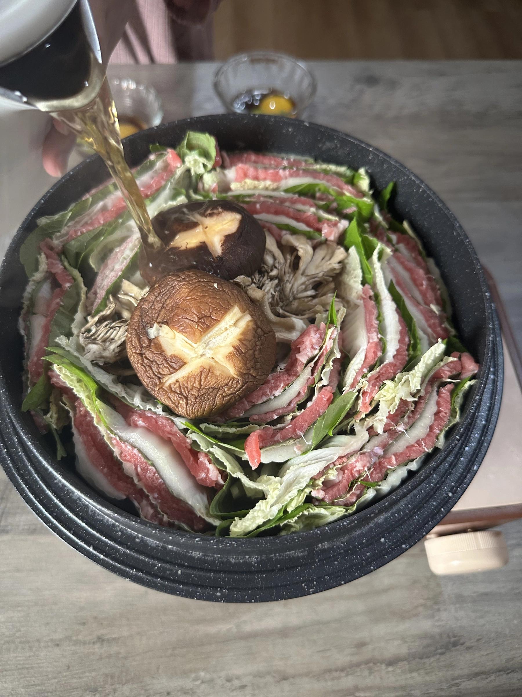 pouring the broth in the pot