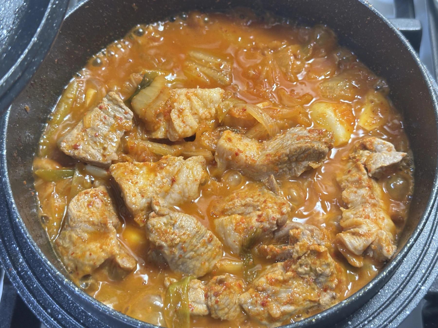 cooking the braised kimchi & pork