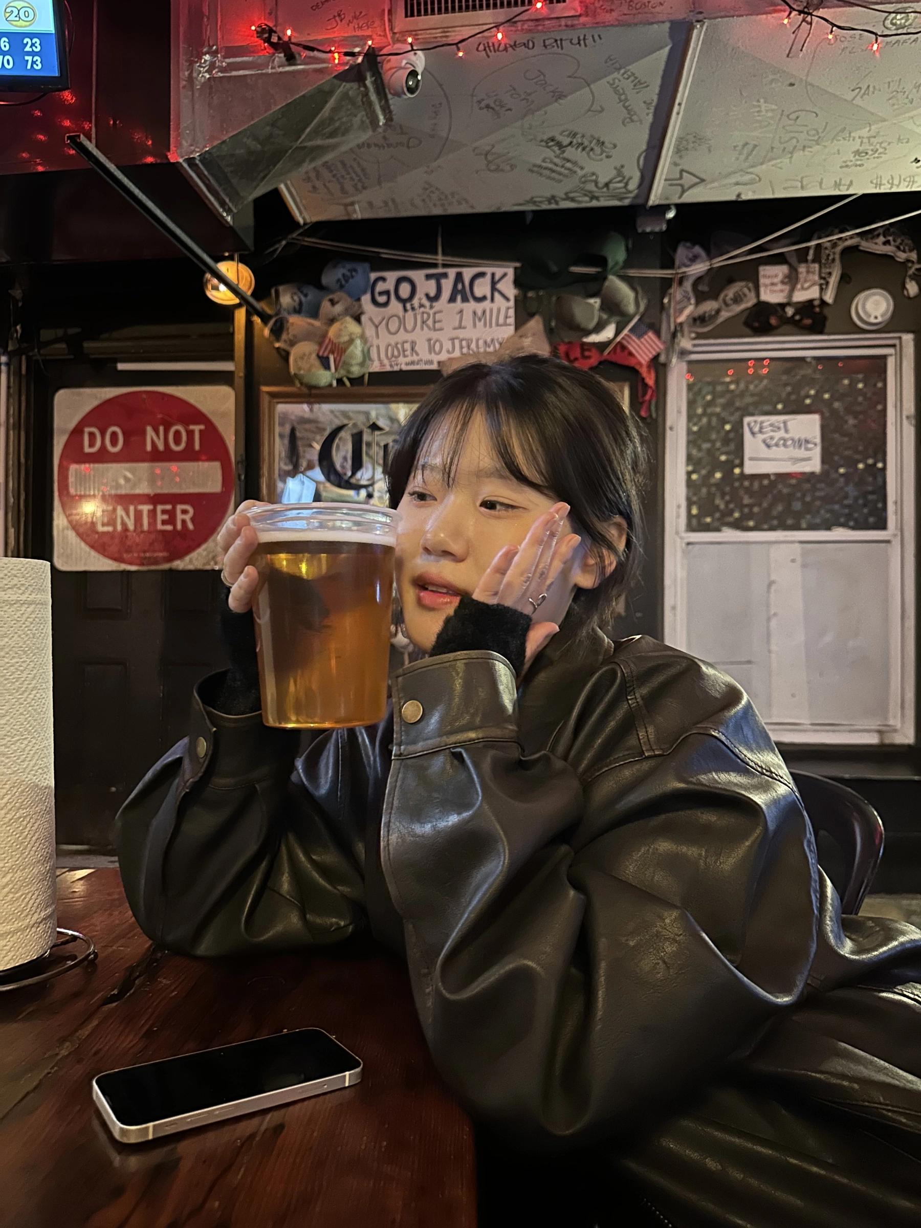 Jenny holding the giant 32once beer