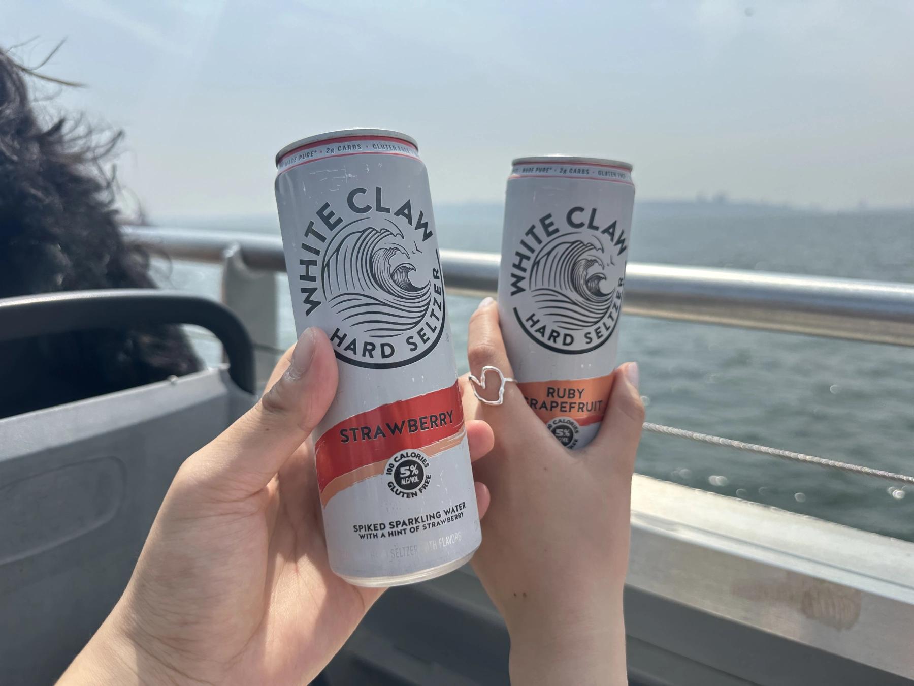 holding white claw
