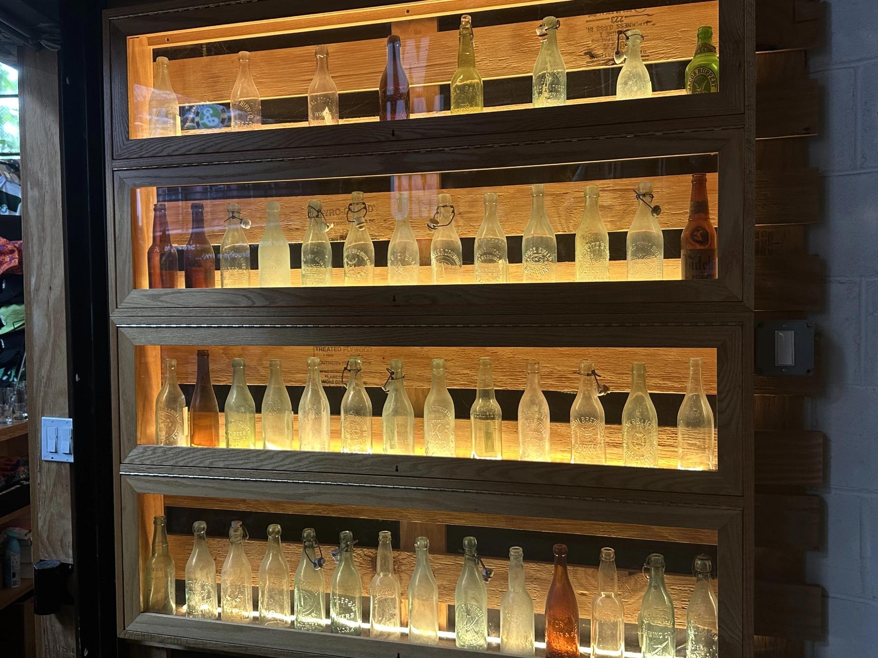 old empty bottle designs displayed in showcase