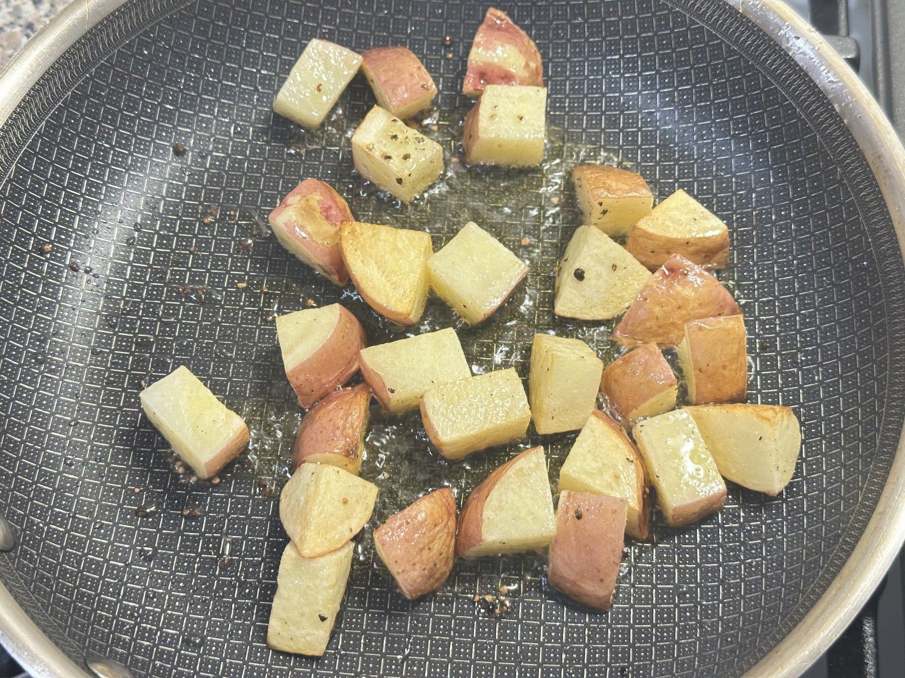 frying potatoes on the pan