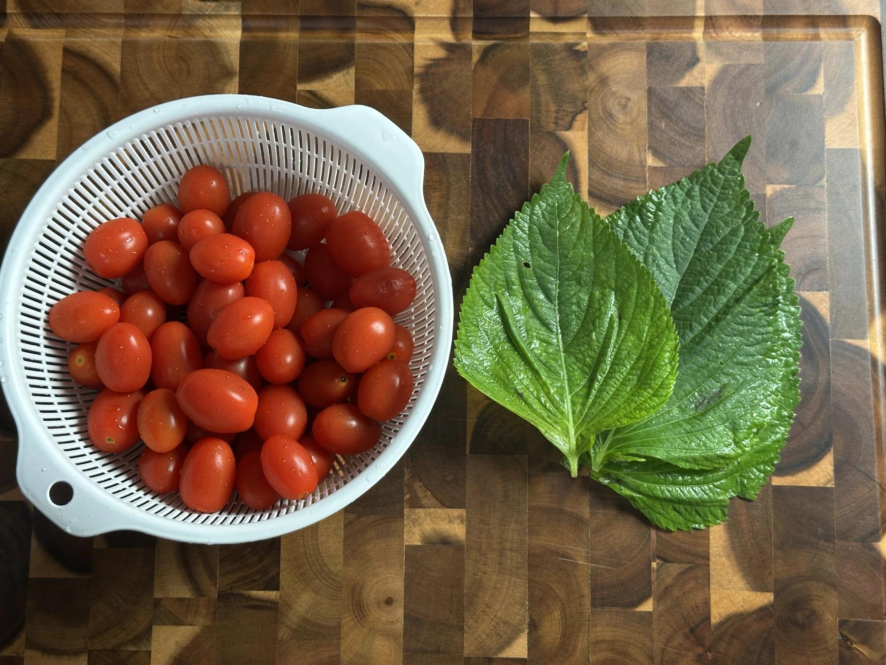 cherry tomatoes and perilla leaves