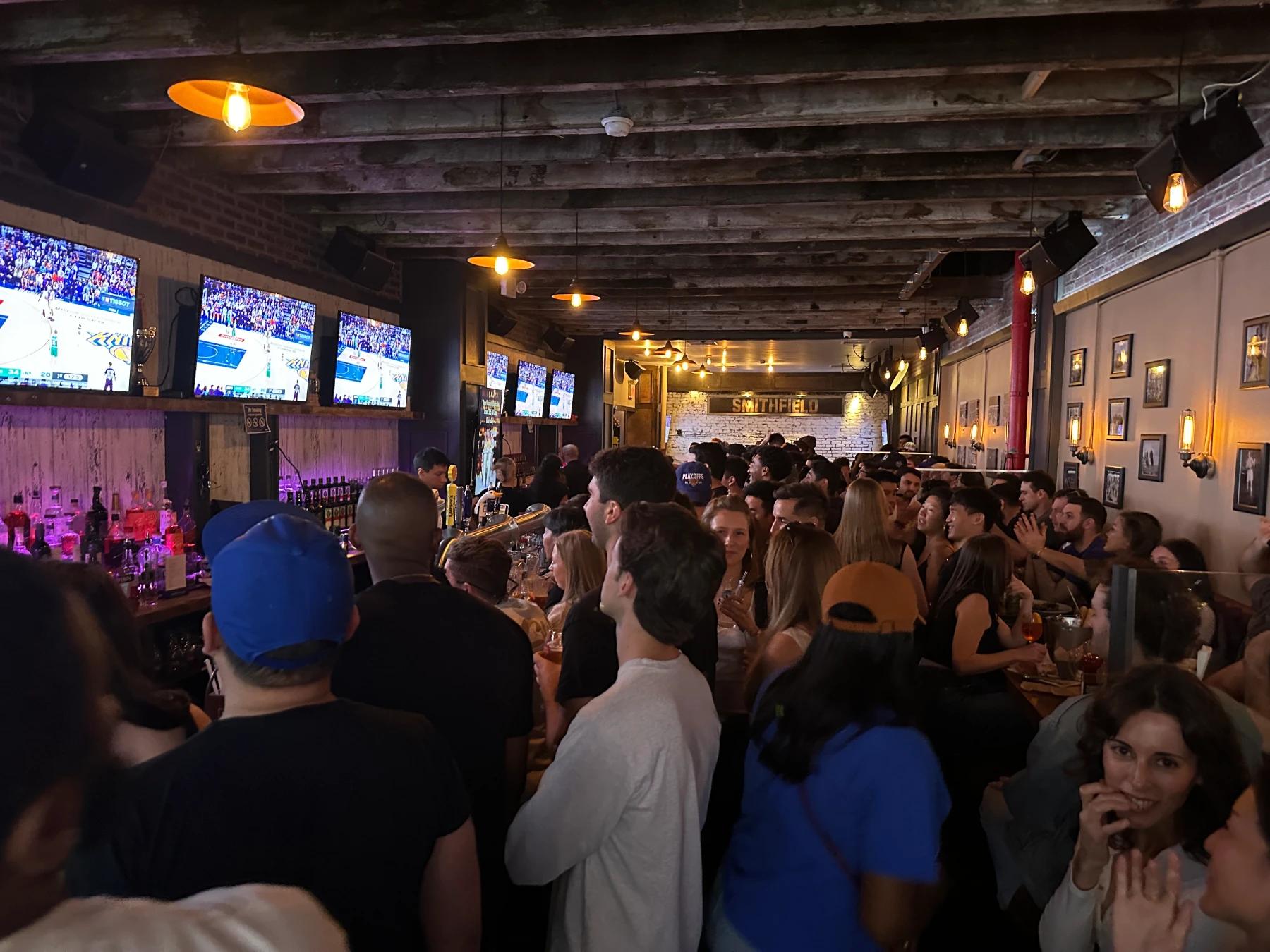 People watching game at the sports bar