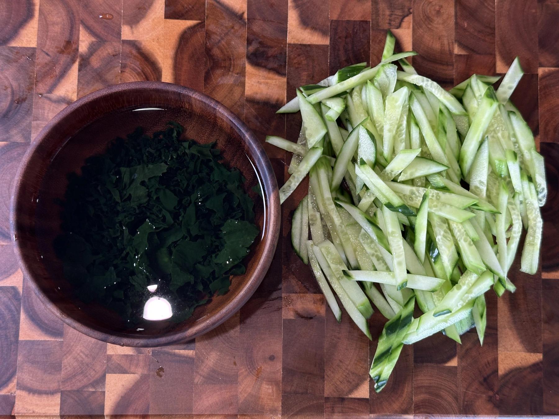 dry seaweed soaked in water and chopped cucumber