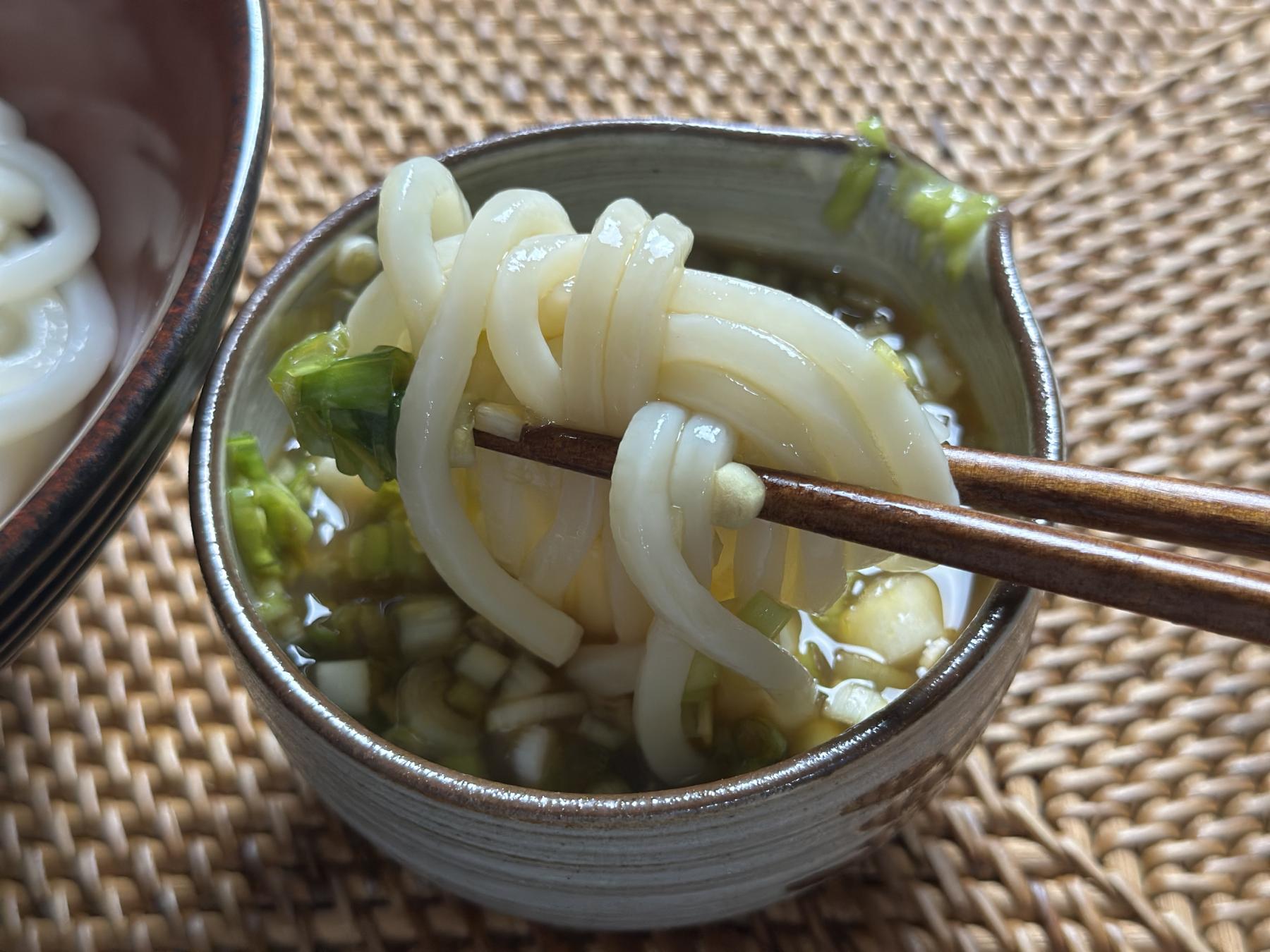dipping cold udon into tsuyu sauce