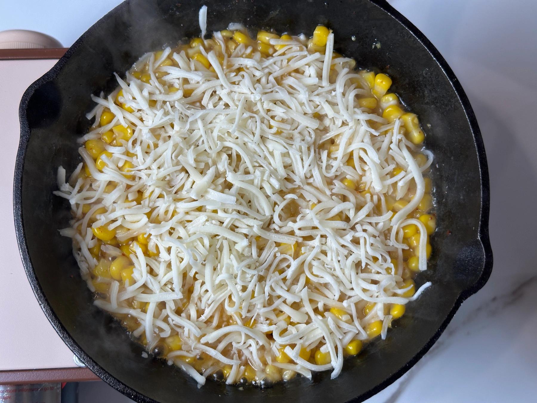 mozzarella cheese added on the corn