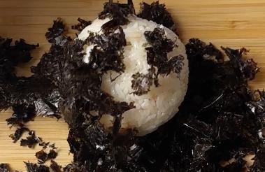 riceball covered with roasted seaweed crumbs