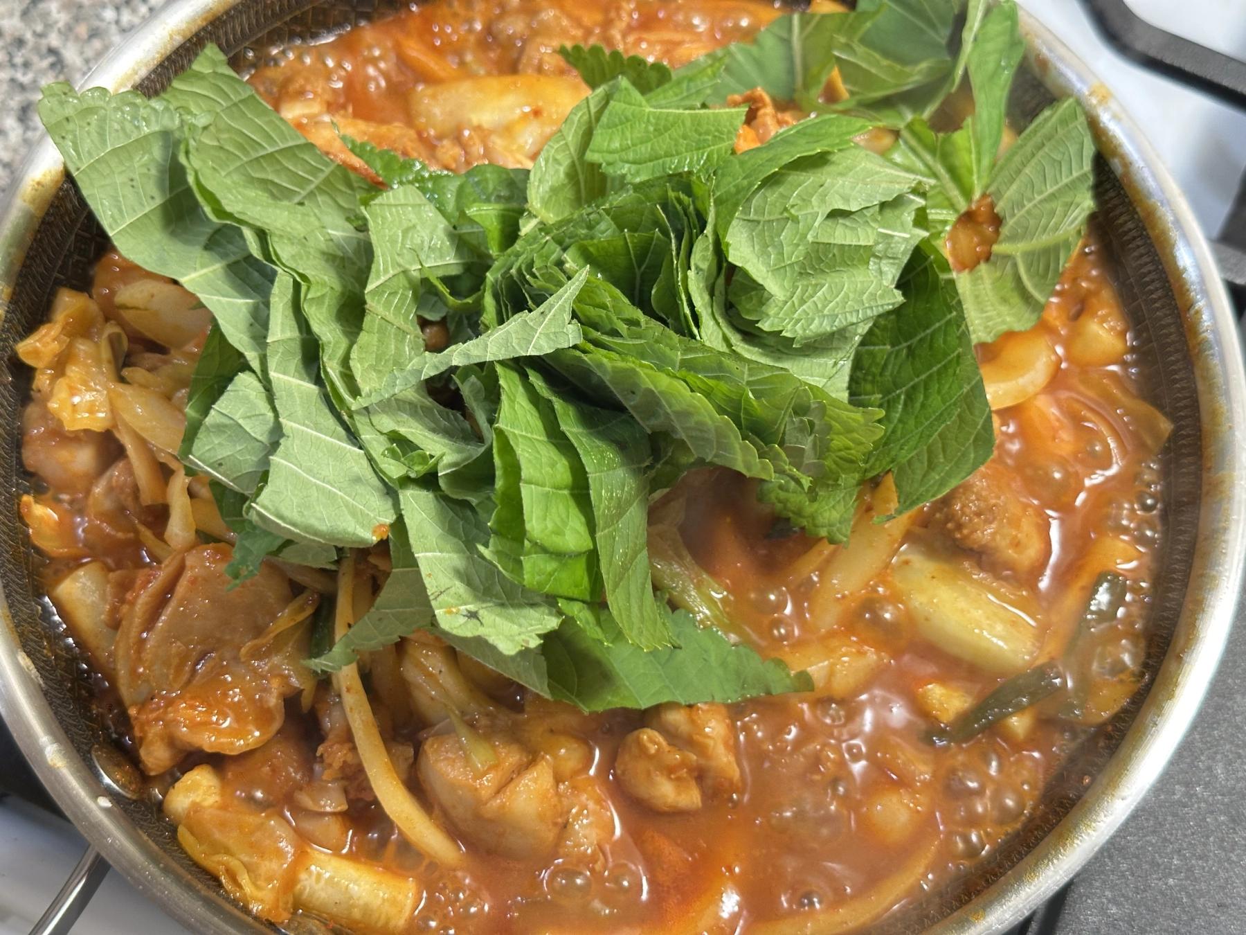 cooking dakgalbi with all vegetables and rice cakes
