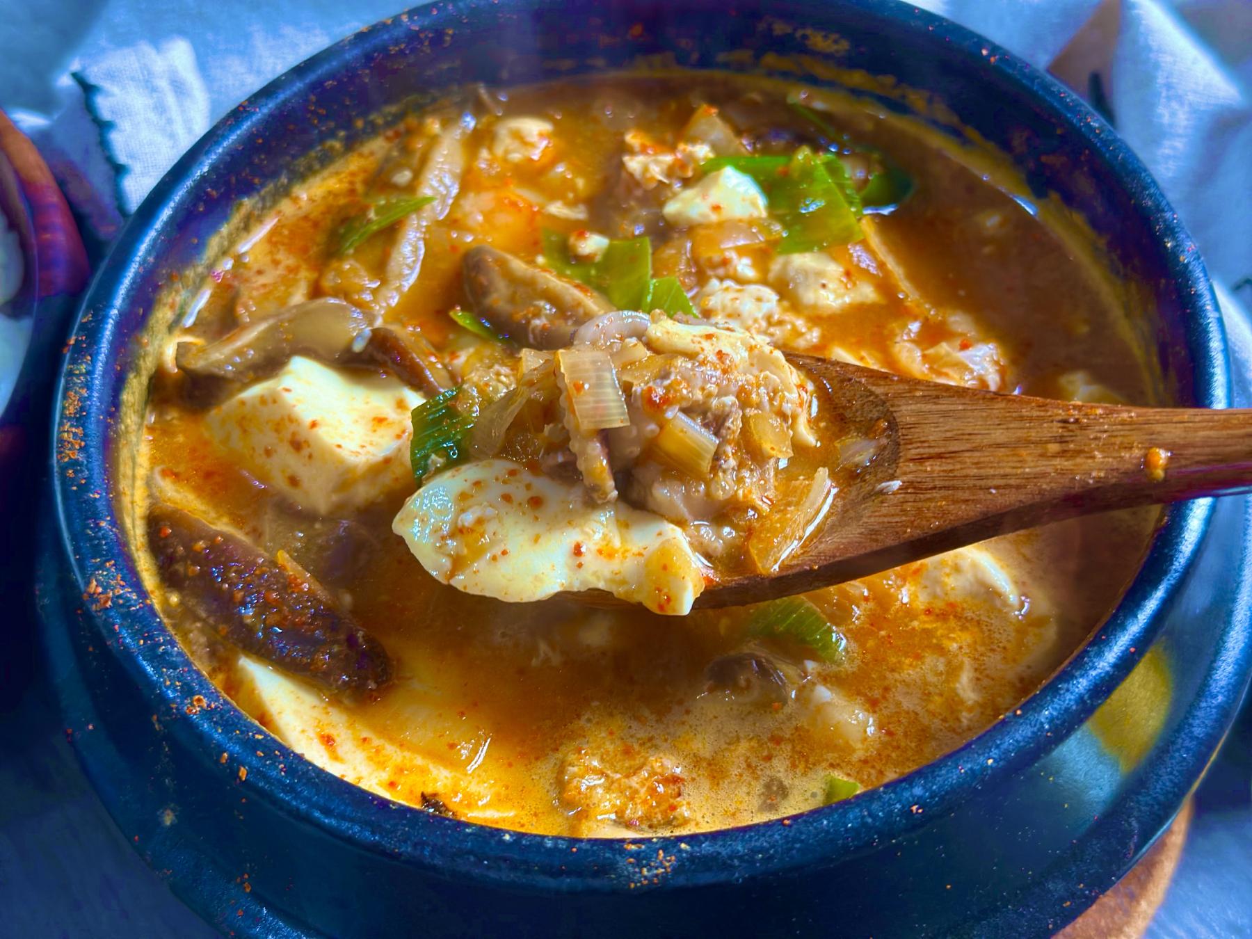 spicy soft tofu stew on the spoon