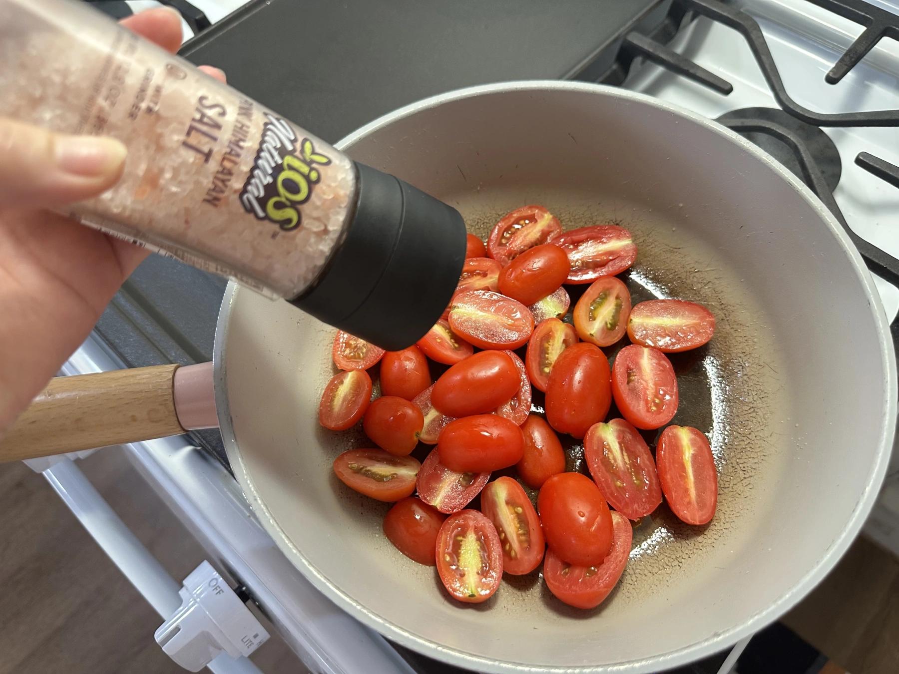 grinding salt into pasta